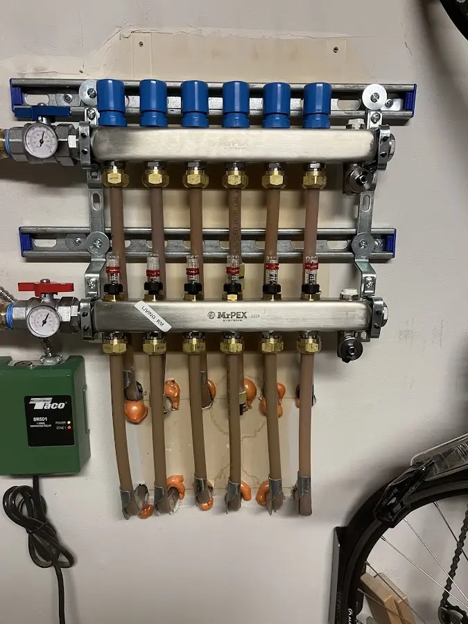 Plumber performing Water Heater Repair at a residential property in Chicopee